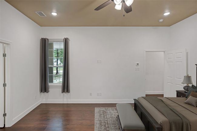 Bedroom with dark wood finished floors, recessed lighting, and a ceiling fan | Image 14