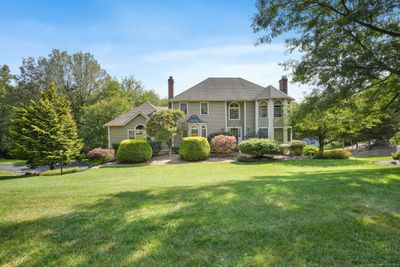 Large front yard with professional landscaping | Image 2