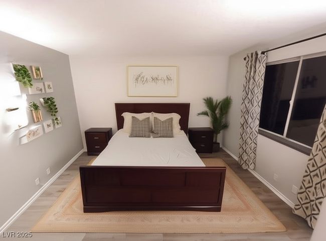 Bedroom featuring light wood-style flooring and baseboards | Image 14