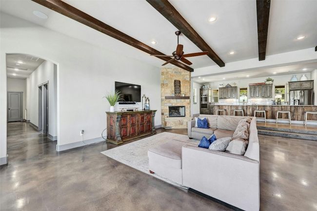 Family time! The entire family can curl up by the fireplace to enjoy time together. Notice the recessed lighting, throughout. | Image 7