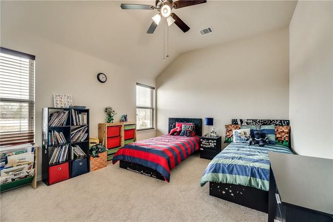 Bedroom featuring carpet, lofted ceiling, and ceiling fan | Image 22