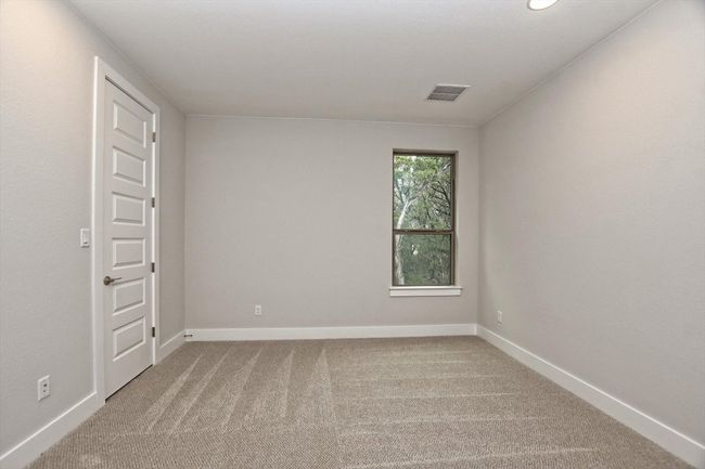 Bedroom with baseboards, visible vents, and carpet | Image 27