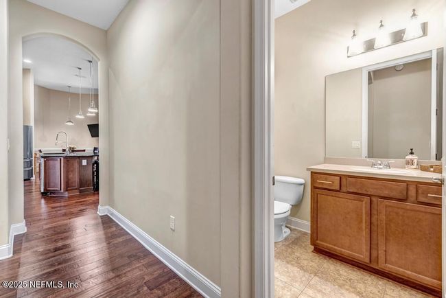 Half bath close to garage access and right outside Theater room/Bedroom 6 | Image 30