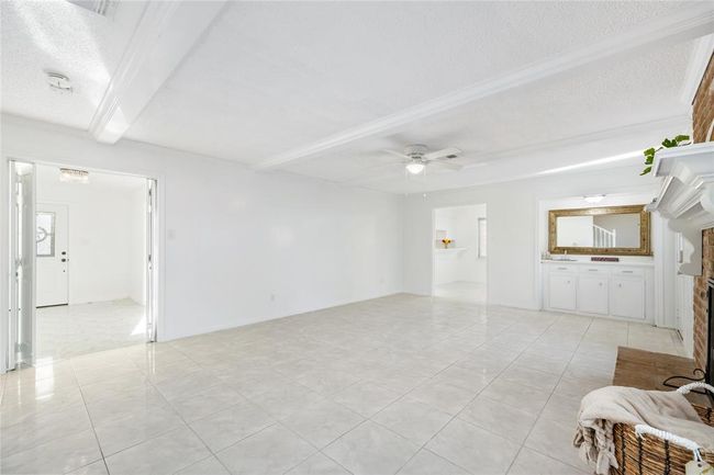 Another view from the stairs looking into the dining an entry | Image 15