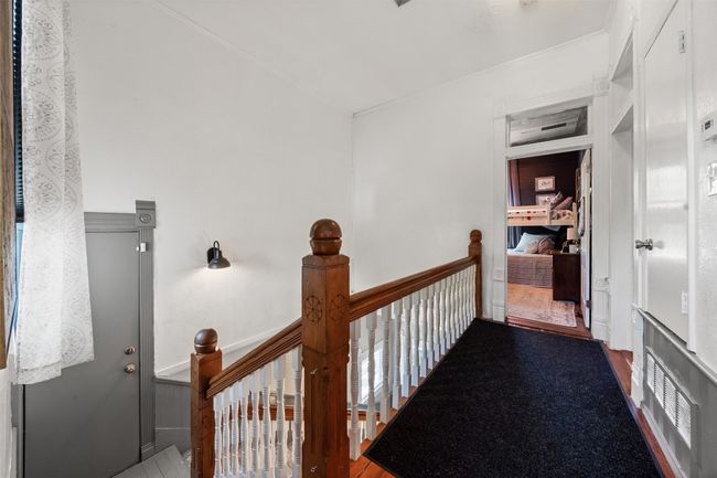 Hallway with an upstairs landing | Image 28