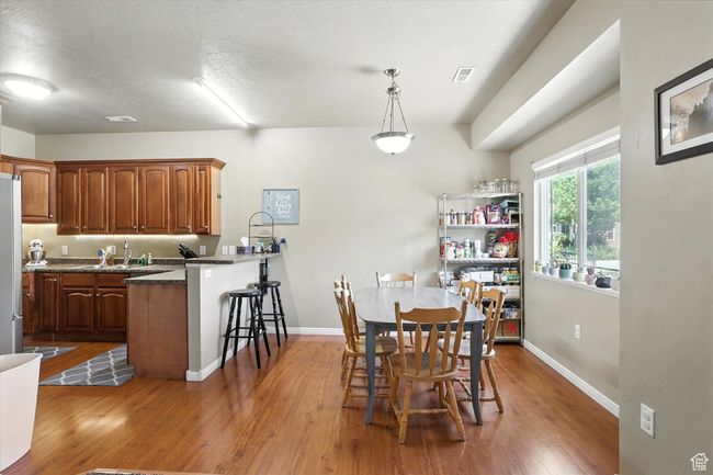 Dining room featuring wood finished floors | Image 7