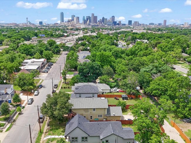 Bird's eye view of skyline and a tree filled landscape | Image 36