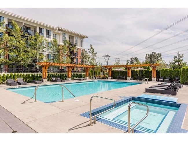 Community pool with a pergola and a community hot tub | Image 18