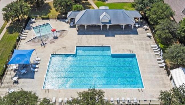 Aerial view of property and surrounding area featuring a pool area | Image 27