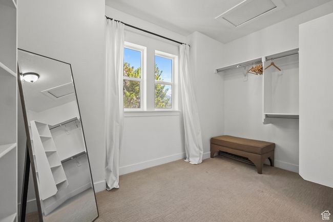 Spacious closet featuring attic access and carpet floors | Image 17