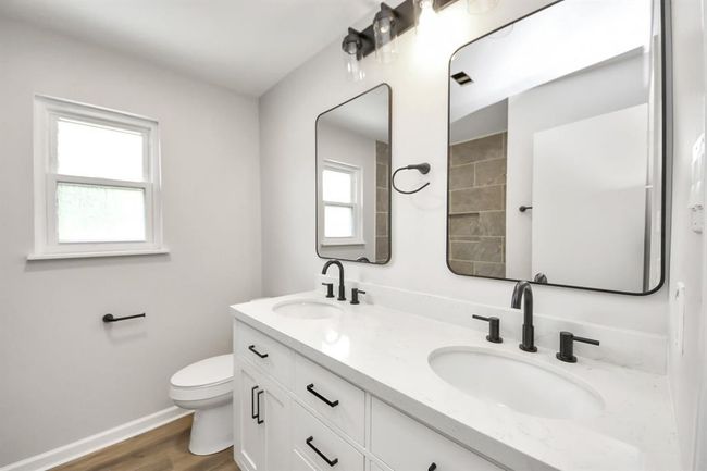 Guest bath with updated cabinets. | Image 38