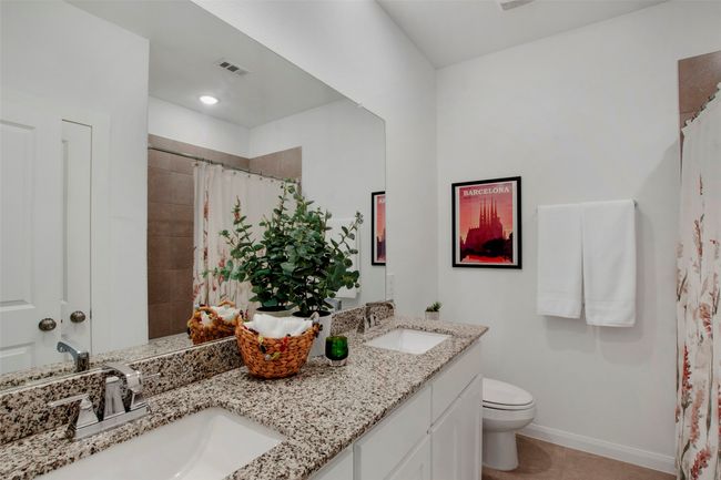 Full bath with double vanity, baseboards, toilet, a shower with shower curtain, and recessed lighting | Image 23
