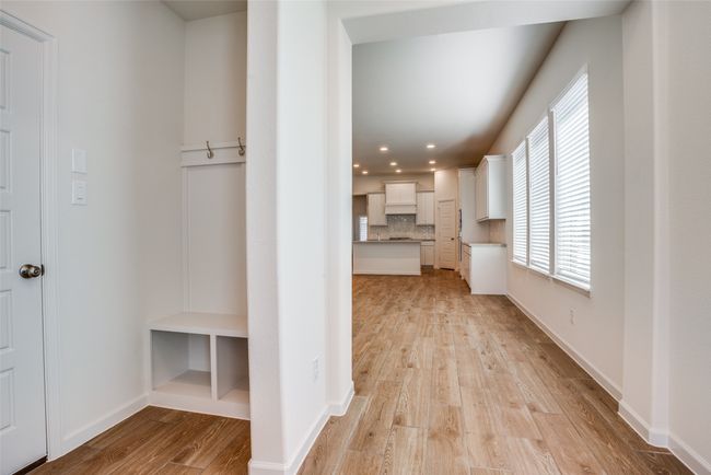 Corridor featuring light wood finished floors, recessed lighting, and baseboards | Image 4