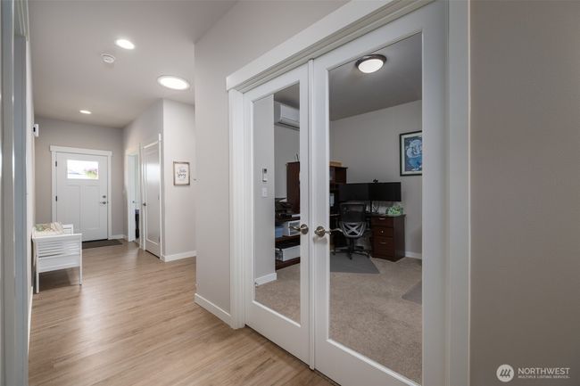 Luxury vinyl plank flooring is throughout the entry, kitchen, great room and dining room. | Image 9