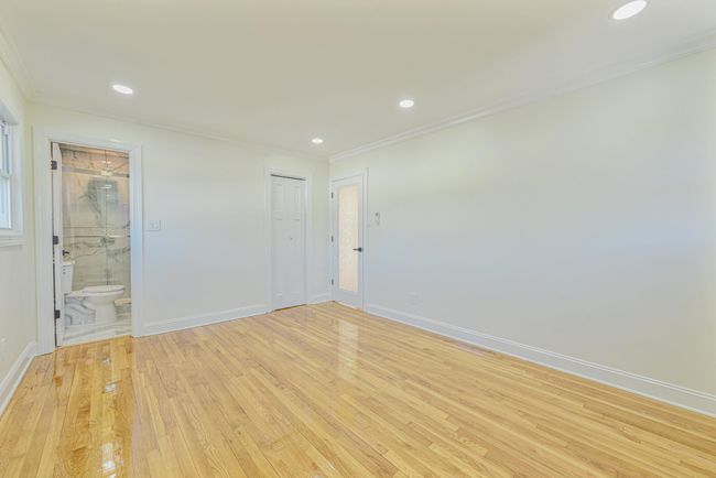Empty room featuring ornamental molding and light hardwood / wood-style floors | Image 29
