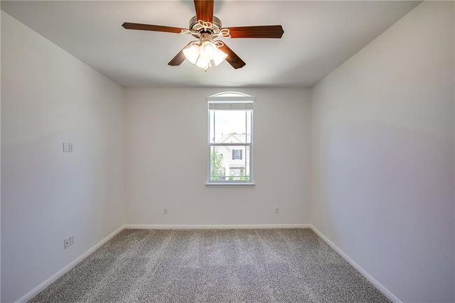 Spare room featuring carpet flooring and a ceiling fan | Image 25