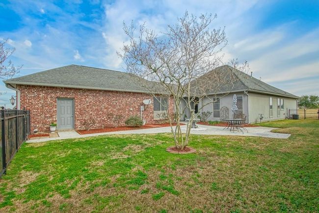 Nice sized gated front yard. Side entry to garage. | Image 4