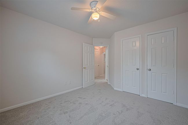 One of three secondary bedrooms upstairs, featuring closet space, all new carpet, and freshly painted walls and ceiling. | Image 34