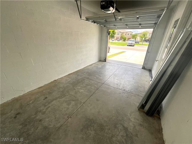 Garage with a garage door opener | Image 19