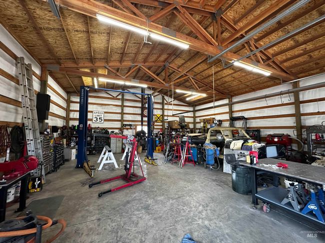 Shop with Power, heat/wood stove, concrete floors & workshop area | Image 49