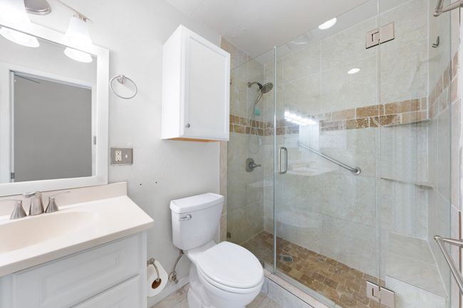 Updated primary ensuite bath has walk in shower with frameless glass. | Image 16
