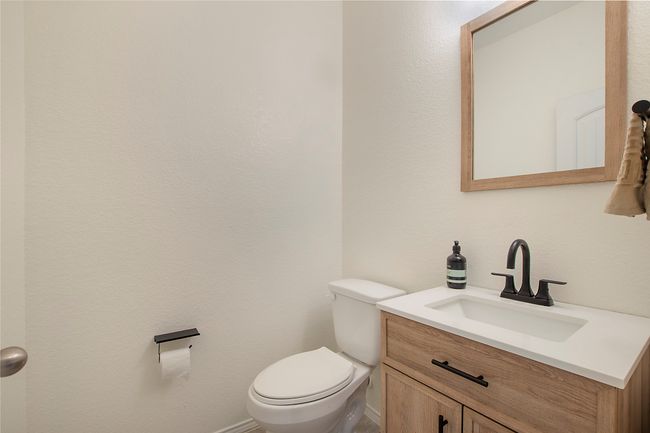 Half bathroom featuring vanity and toilet | Image 19