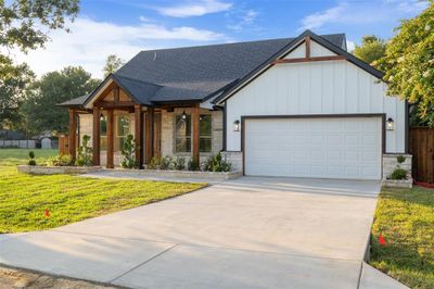 View of front of home with a garage and a front lawn | Image 3