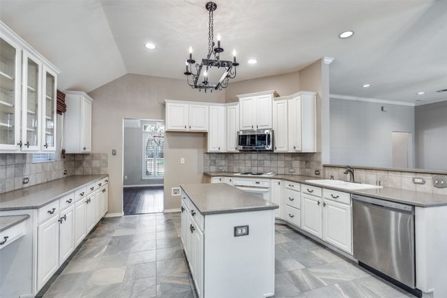 Kitchen features stainless applicances and an abundance of storage. | Image 9