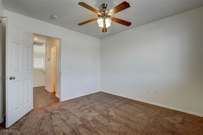Spare room with a ceiling fan, carpet flooring, and baseboards | Image 20