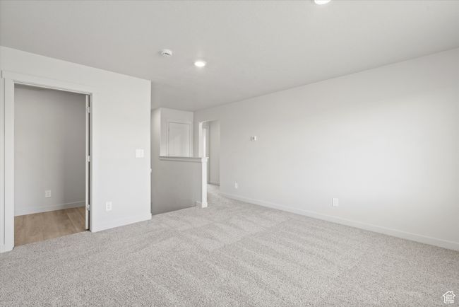 Unfurnished bedroom featuring light colored carpet and recessed lighting | Image 25