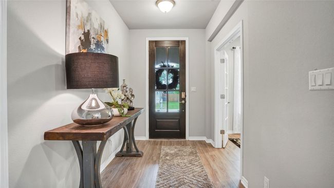 Foyer entrance featuring baseboards and light wood-style floors | Image 8