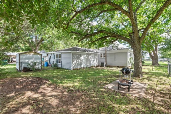 View of yard with a fire pit | Image 32