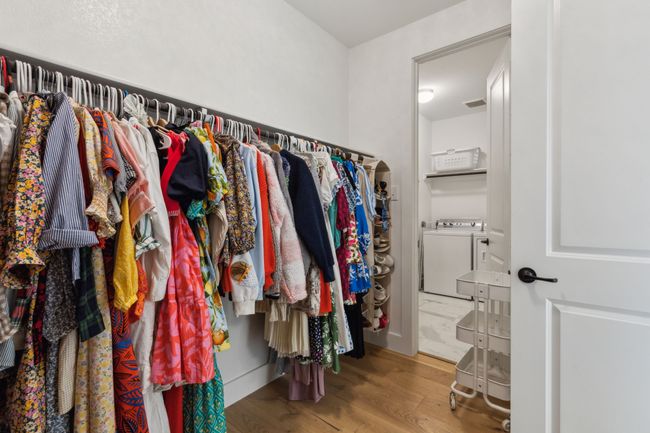 Primary closet has a pass through to the Laundry Room allowing you to easily take clothes from the dryer right onto the rod | Image 21