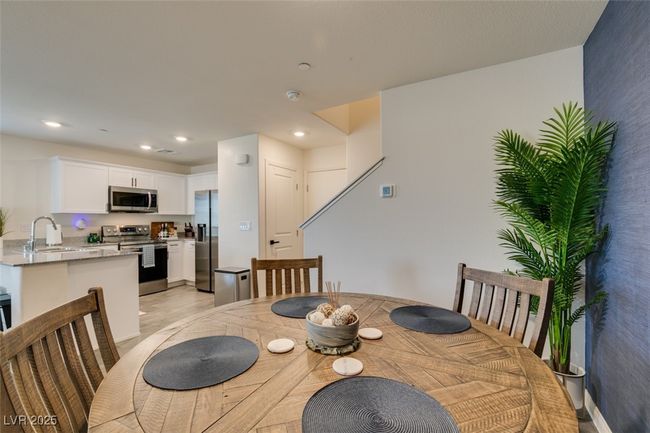 Dining room with light wood-type flooring and recessed lighting | Image 17