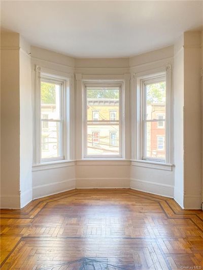 Unfurnished room featuring parquet flooring | Image 2