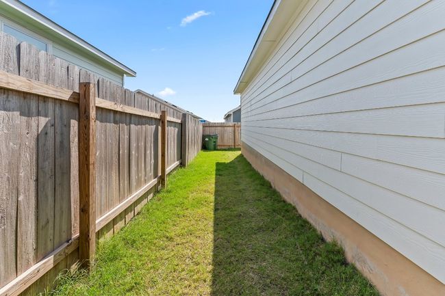 View of fenced backyard | Image 28