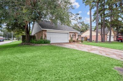 Spacious corner lot is a gardener's paradise. | Image 3