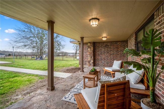 View of patio with outdoor lounge area and fence | Image 42