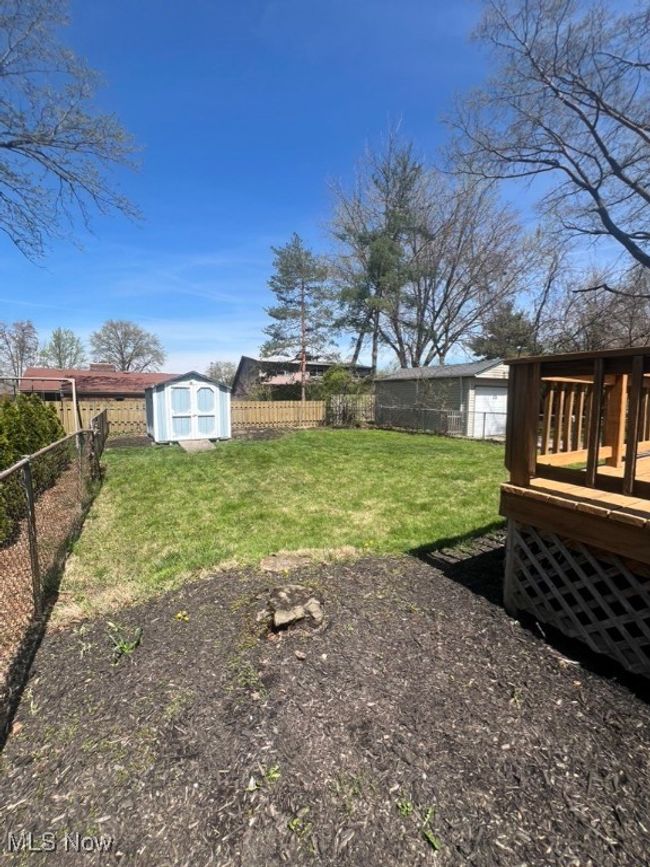 View of yard featuring a shed | Image 34