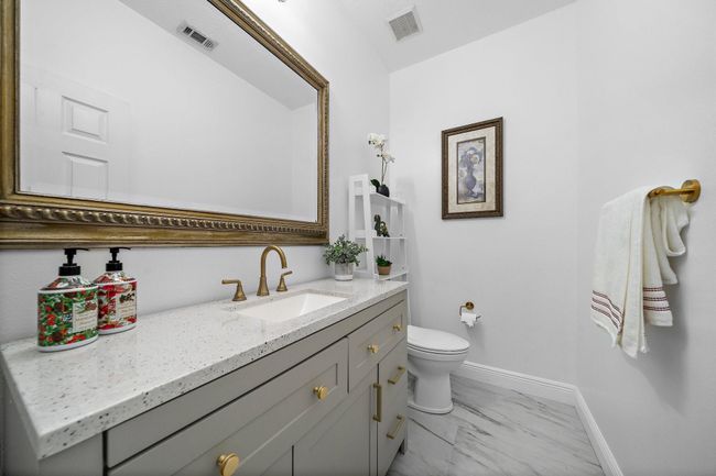 Bright powder room with neutral tones and clean design | Image 23
