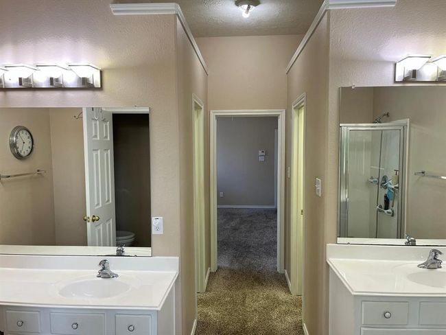Dual Vanities and 2 Separate Closets. | Image 9