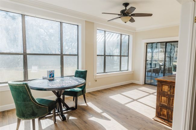 Sunroom / solarium with ceiling fan and plenty of natural light | Image 14