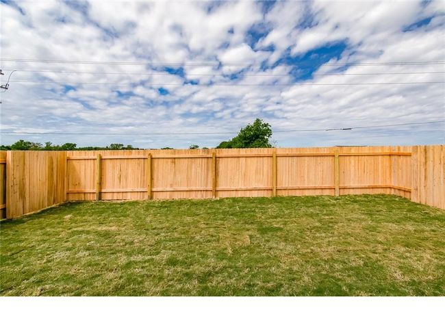 View of fenced backyard | Image 27