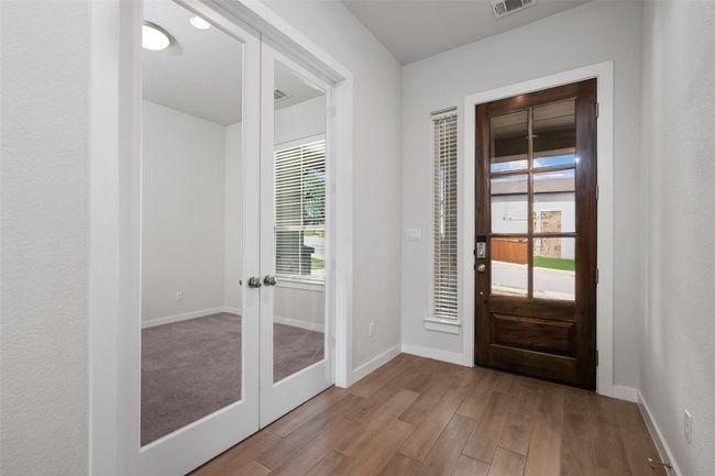 Foyer featuring French doors and wood-like tile floors | Image 4