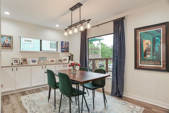Dining room off the kitchen and open to the living area full of natural light | Image 14