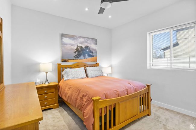 Bedroom featuring baseboards, recessed lighting, light colored carpet, and a ceiling fan | Image 19