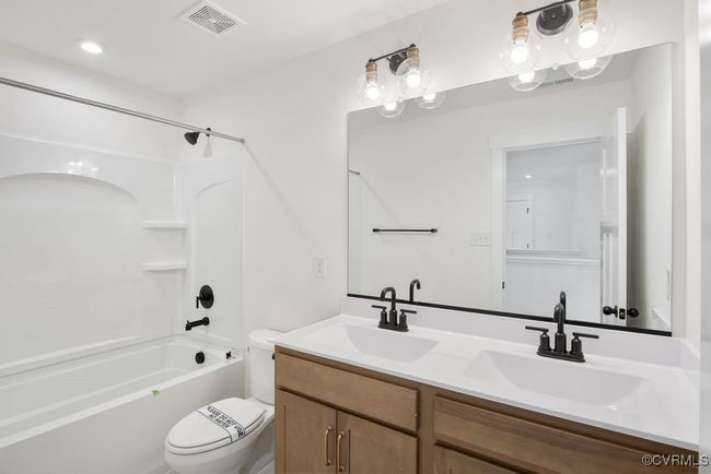 Photo represents the plan, not the actual home. Design selections may vary. Second floor hall bath. Bedrooms 2 and 3 with walk-in closet. Bedroom 4 with double door closet. | Image 33