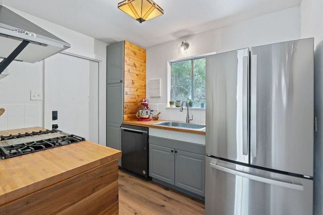 Stainless appliances and butcher block countertops | Image 9