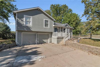 View of front facade with a garage | Image 2