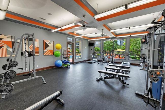 Workout area with visible vents, baseboards, a ceiling fan, and coffered ceiling | Image 13